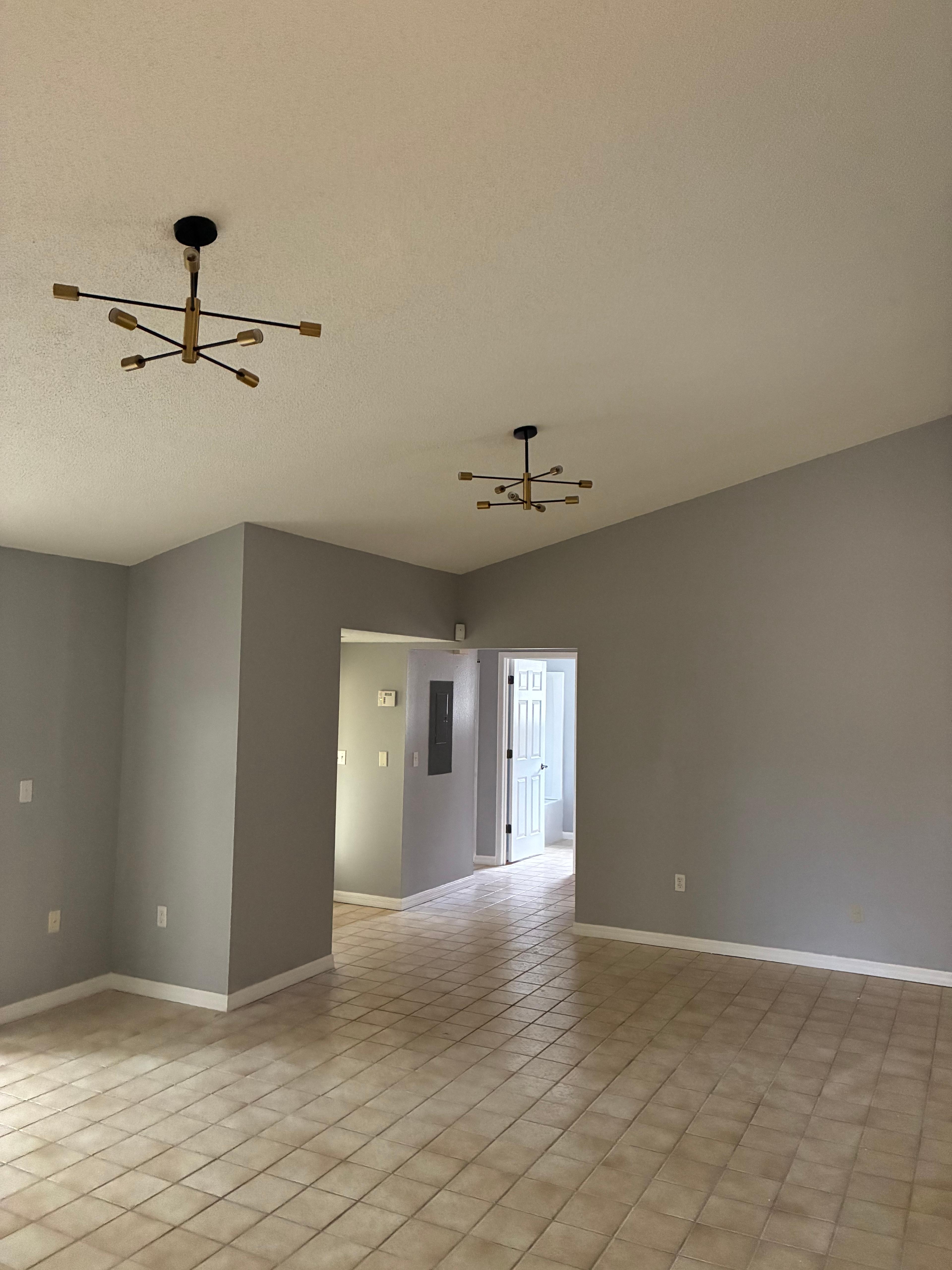 Finished drywall with modern lighting fixture