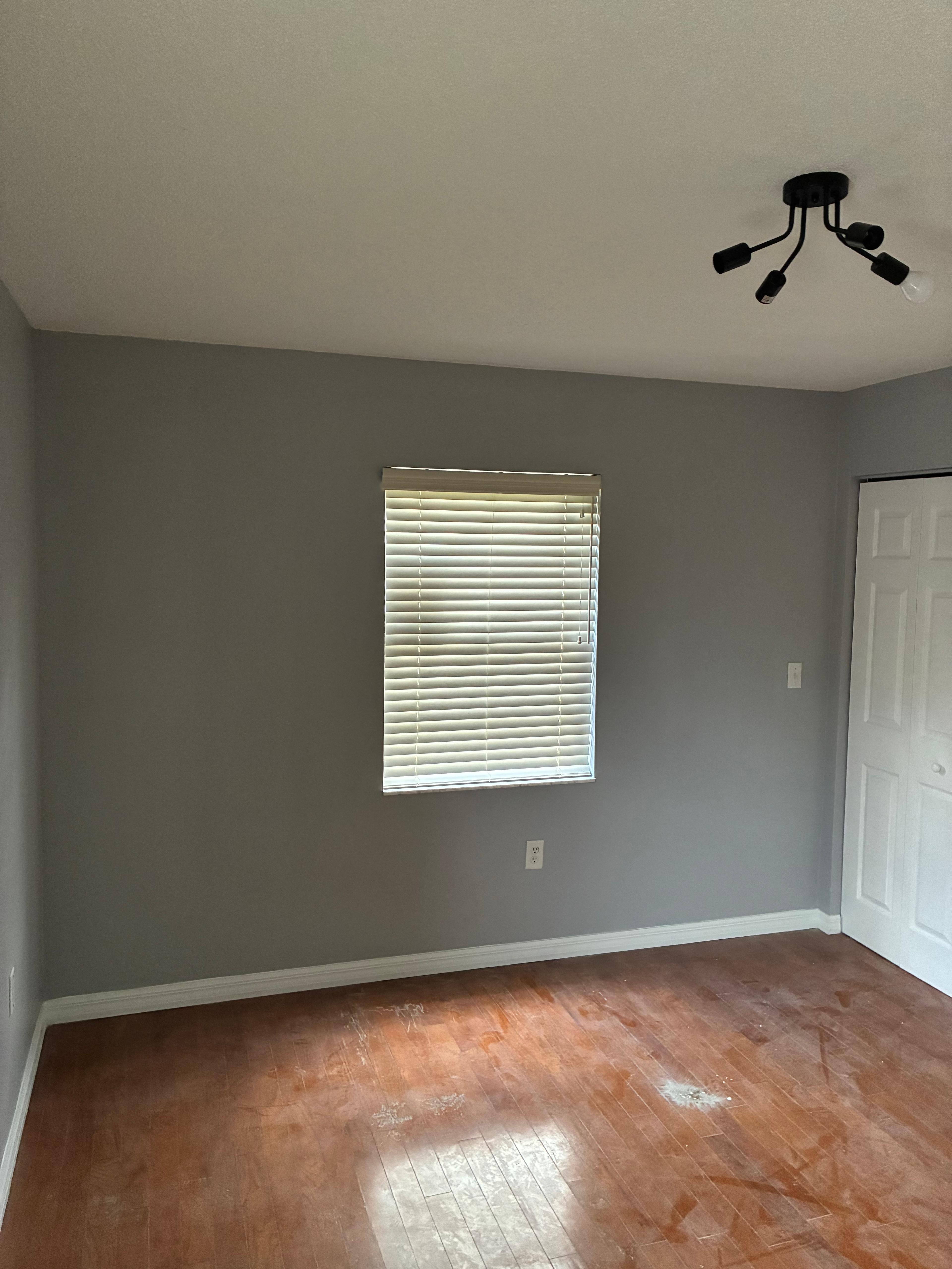 Bedroom with fresh paint and hardwood floors